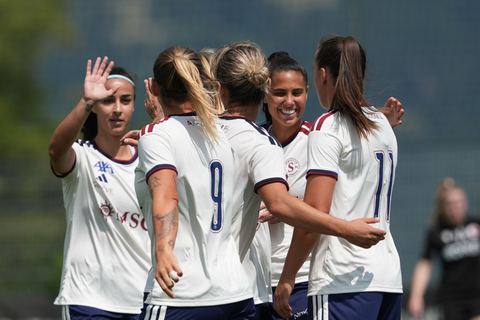 Crans-Montana, Switzerland - July 25: Gloria Marinelli (9 SFCCF) celebrates with the Team Daina Bourma (3 SFCCF) during the AXA Women's Super League match between Servette FC Chenois Feminin and FC Sion Feminin at Stade du Christ-Roi on July 25, 2026 in Crans-Montana, Switzerland.